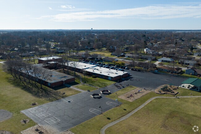 Teachers at Northmoor Elementary School greet their students with warm smiles.