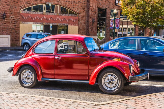 Classic cars like this Buggy fill the streets of the historic neighborhood in Oyster Point.