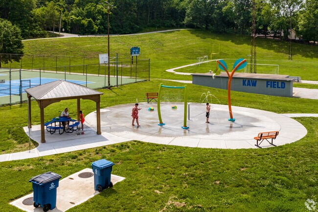 Kids can run through the water at the Splash pad at Kaw Fields.