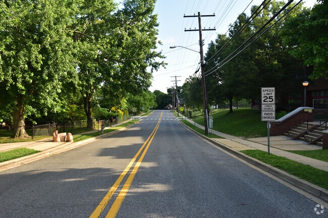 A quiet residential street winds through the Coral Hills neighborhood.