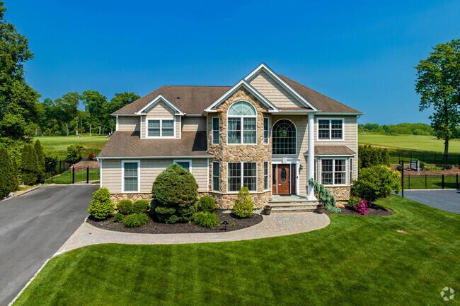 This modern colonial in Setauket is a real beauty with a well-landscaped lawn.
