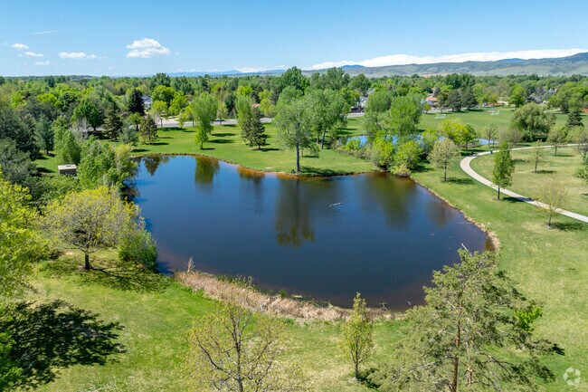 Troutman Park's serene lake offers a peaceful retreat just steps from home, perfect for fishing, picnics, or a leisurely stroll.