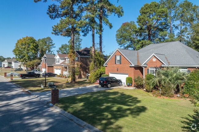 Driveways and garages are standard in Olde Mill, but the neighborhood does lack sidewalks.