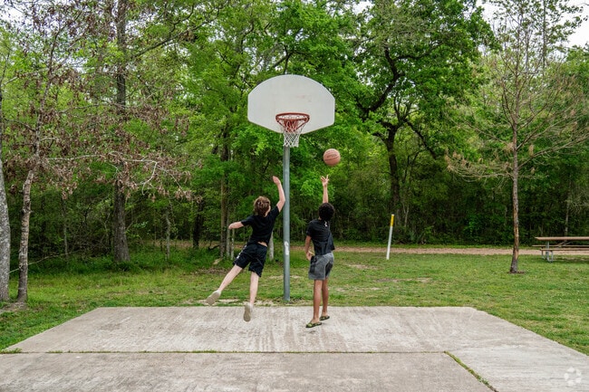 Basketball courts at Camp Mohawk provide recreation near Liverpool.