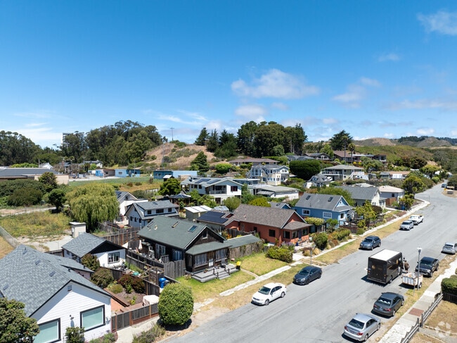 Small cottages and two-story homes cluster near Highway 1 in coastal Davenport.