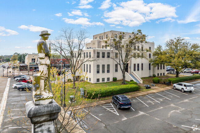 Explore the historic Titus County Courthouse in downtown Mount Pleasant, featuring a monument statue that stands as a tribute to the area’s rich history.
