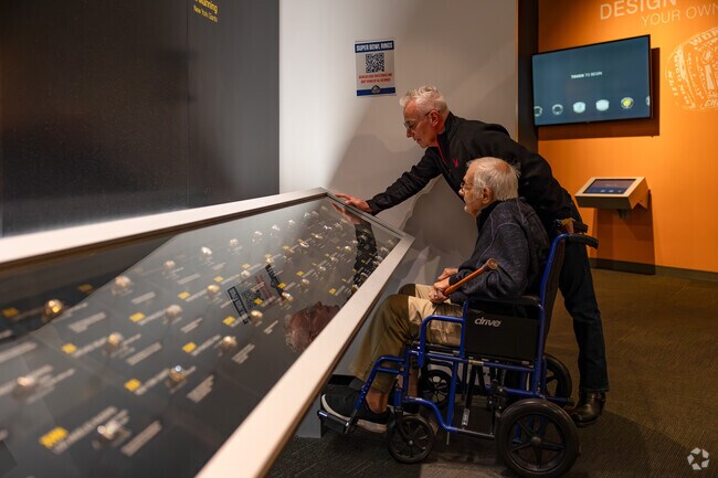 Residents of Gibbs Area enjoy an afternoon admiring the Pro Football Hall of Fame not far away.