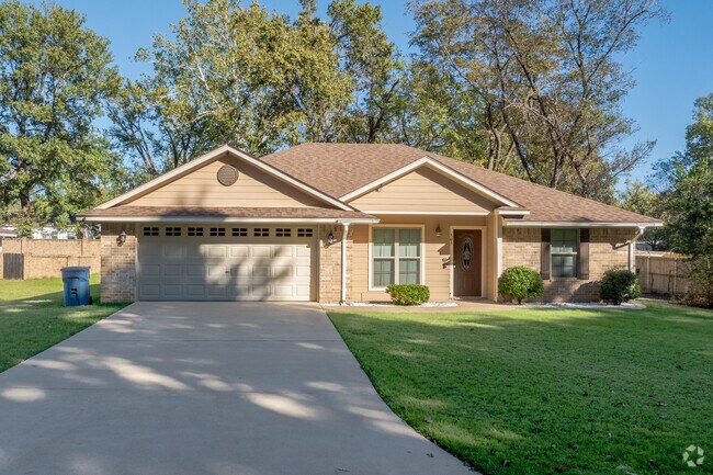 Downtown Lindale homeowners show neighborhood pride with neatly manicured lawns.