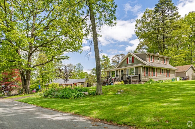 This inviting cottage, framed by mature trees and lush plantings, whispers nostalgia while offering the comforts of home—Frankford charm at its finest.