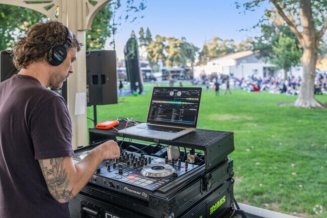 Before the movie at Walnut Creek's Civic Park, a DJ spins tunes to get everyone in the mood.