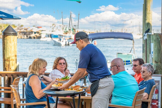 Watch the shrimp boats come in as you grab a bite to eat on San Carlos Island.