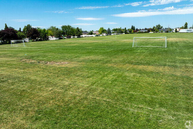 Expansive multi-use fields at Syracuse Jr. High are equipped with soccer goals.