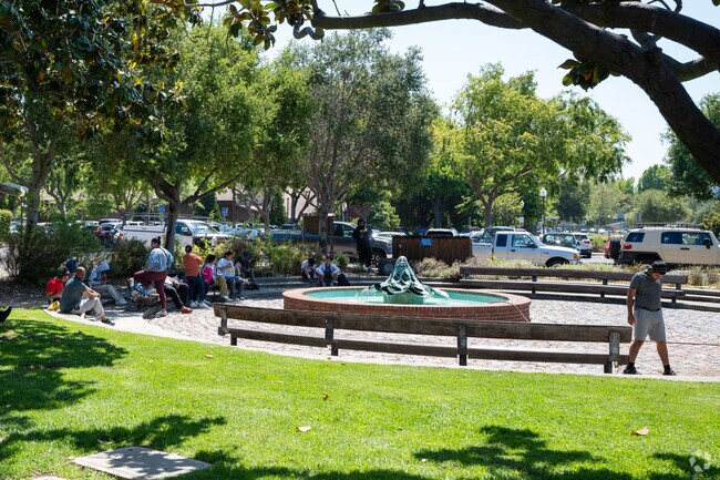 People gather in front of the Arrillaga Family Recreation Center, fostering community spirit.
