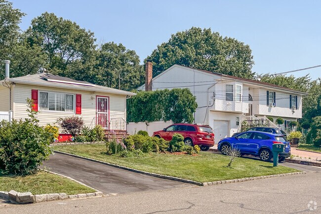 Manicured lawns are the norm in Wyandanch.