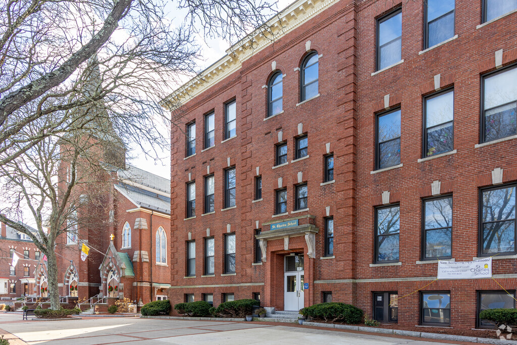 The St. Charles Elementary School with the main church building behind it in Woburn, MA.