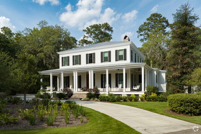 Large new construction home with wrap around front porch in Isle of Hope.