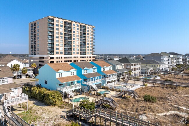 Some home owners use vibrant colors on their coastal styled homes in Cheery Grove Beach.