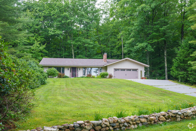 If you're not living by the lake, your home will sit in the mountains around Center Harbor.