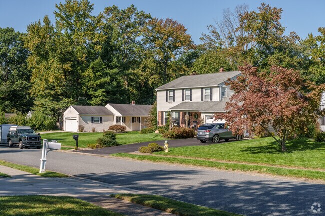 In Talleyville, a Colonial-style house stands alongside a ranch-style neighbor, highlighting varied home designs.