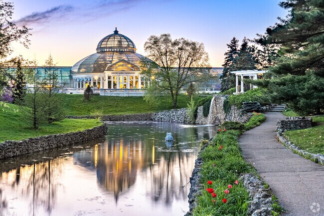 The frog pond at Como Park is a popular place to watch the sunset over the conservatory.