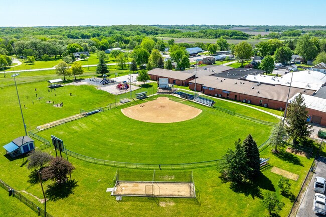 The softball field is directly behind the school.