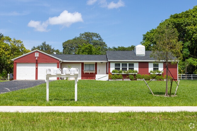 Larger ranch-style home with huge front and back yards around it in th441 Corridor neighborhood.