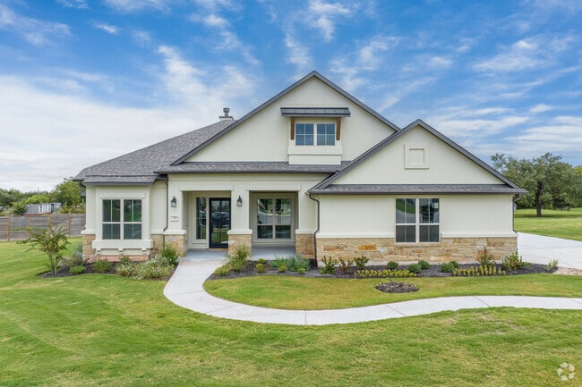 Liberty Hill boasts beautiful homes with diverse facades and lush green lawns.