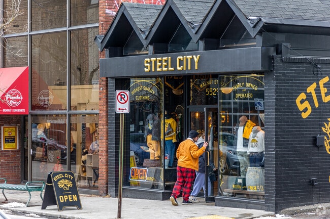 Residents walk in to Steel City in Shadyside.