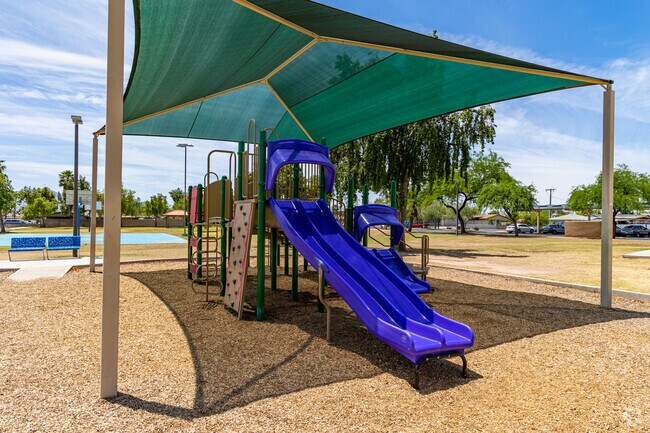 Dennis Deconcini Park in Old Town features shaded slides and playground equipment.