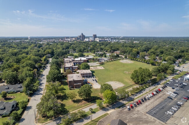 Melvin C. Swann Jr. Middle School with Greensboro downtown in the background.