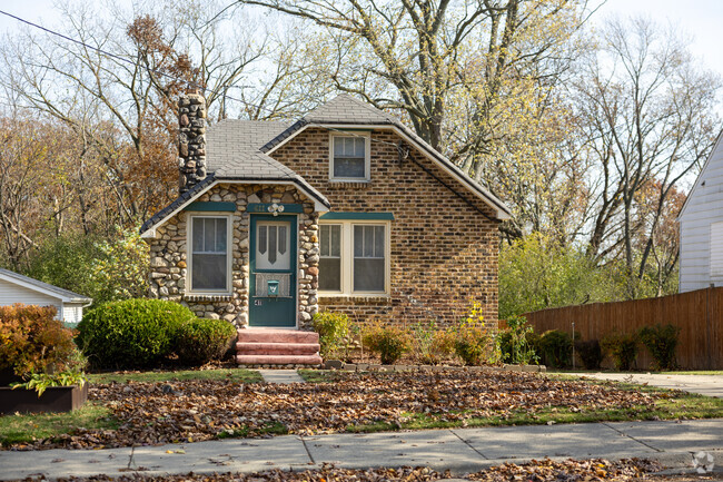 Find a turnkey home like this unique stone and brick cottage in Hidden Glen.