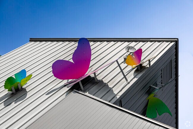 Colorful art adorns many of the commercial buildings in Green Oak.