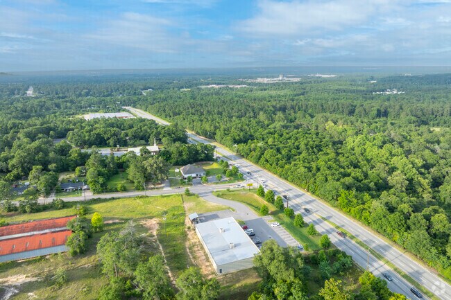 McDade’s land between Route 25 and Old Waynesboro Road transitions from dense trees to rural plots.