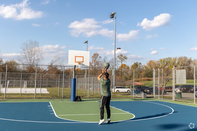 Eugene Levy Memorial Park offers basketball courts for pickup games and evening play.