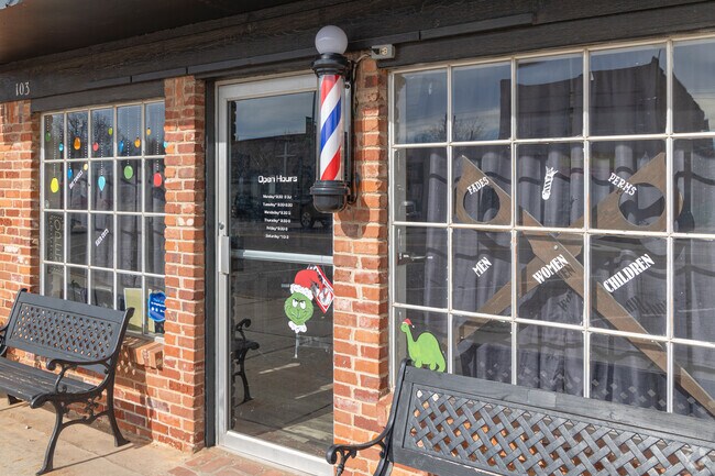 Get a haircut at this classic barber shop, A Cut of Whiskey.