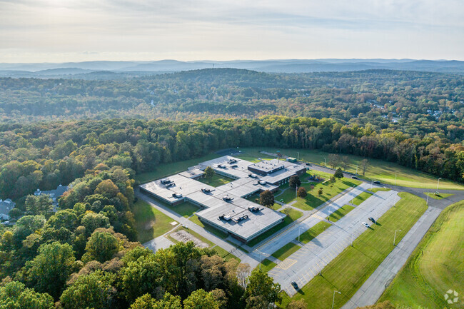 Benjamin Franklin Elementary School is surrounded by trees and greenery,