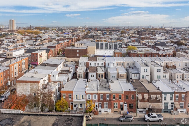 The streets in Passyunk Square are a grid lined with row homes and shops.