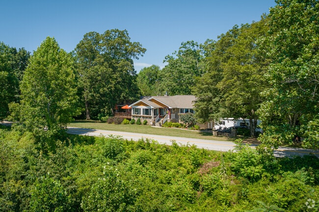 Some of Walden's brow lots are home to smaller cottages and ranchers.