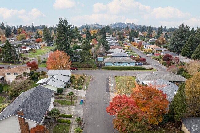 Straight streets lined with sidewalks and mid-century homes characterize the Russell neighborhood in Portland.