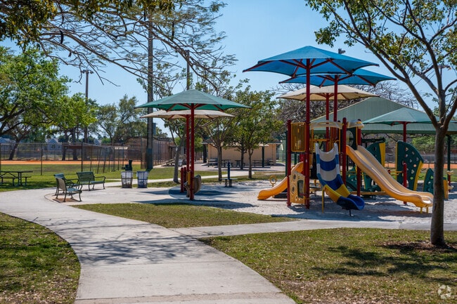 The Hammocks Community Park has a bright and shaded playground loved by all.