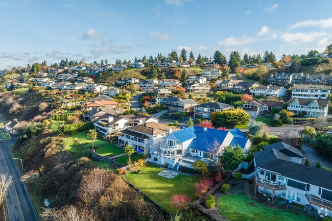 Many homes in Steilacoom sit along rolling hills amongst the tall trees.