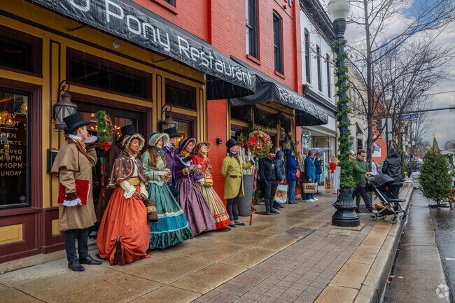 Carolers sing Christmas songs at the Dickens of a Christmas festival in Downtown Franklin.