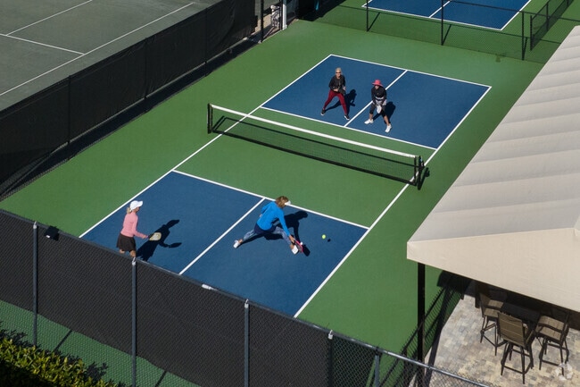 Royal Poinciana residents in Moorings Park Hawkes Ridge enjoy playing a game of pickleball.