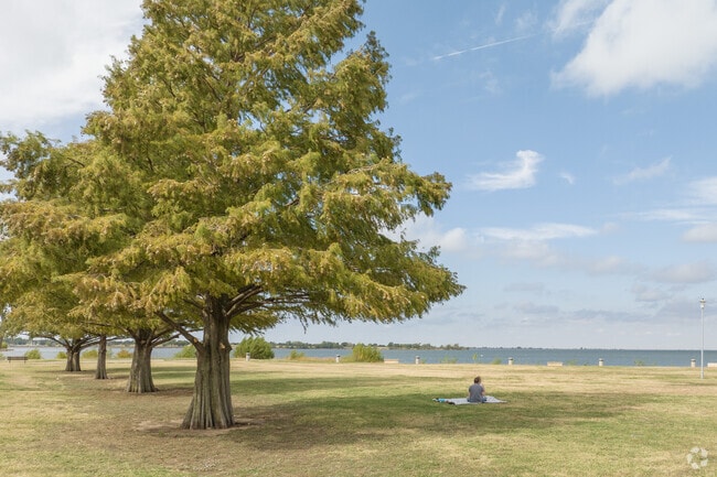 Picnic spots along Lake Hefner offer shade and lake views near The Village.