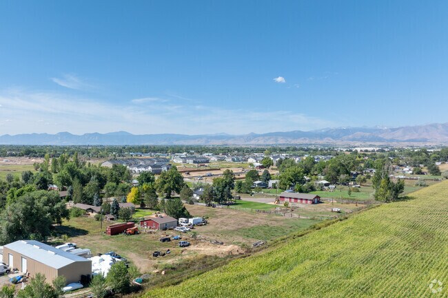 Stunning aerial view of West Saint Vra, revealing a tapestry of homes and green spaces.