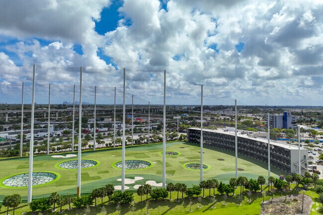 Golfers can use three levels of the Top Golf driving range in Scott Lake, Florida.