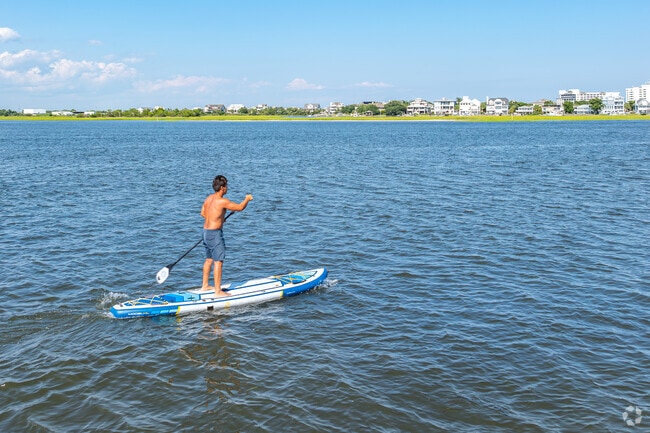 Bill from Seagate South enjoys paddleboarding in the backwaters of the Intracoastal.