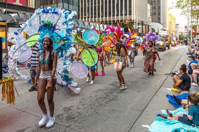The crowds enjoyed the energetic dance performance at the Aquatennial Torchlight Parade.