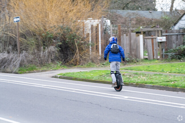 Locals use a variety of means to get around the Far West Neighborhood including one-wheels.