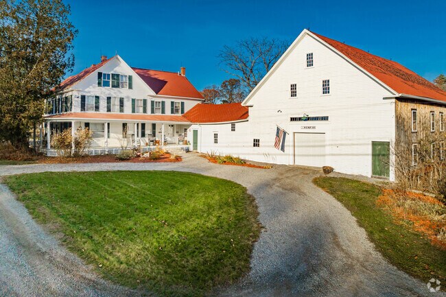 This beautiful farmhouse in Goffstown sits on several acres of pristine farmland.